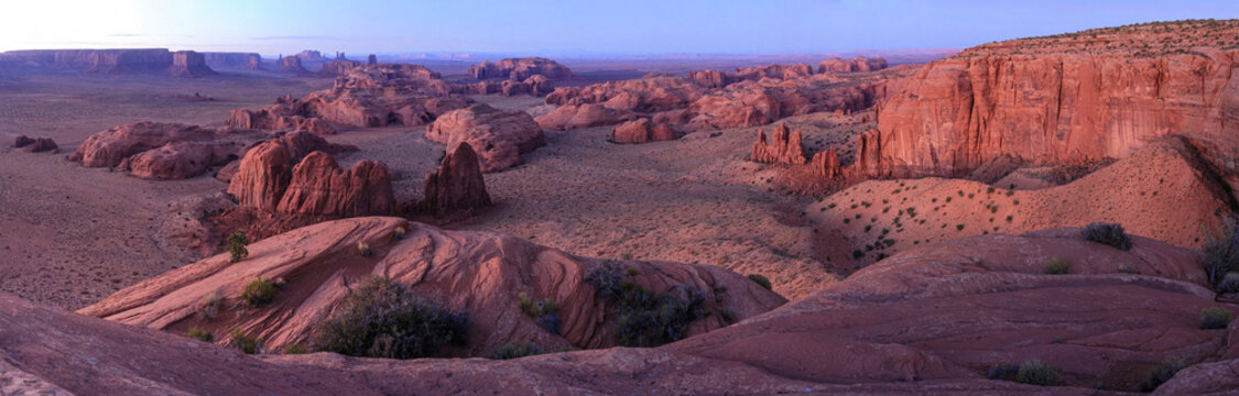Beautiful wide panoramic view of giant sandstone canyon rock formations in desert at sunset