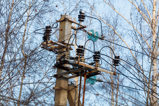 Weathered utility pole with insulators and wires