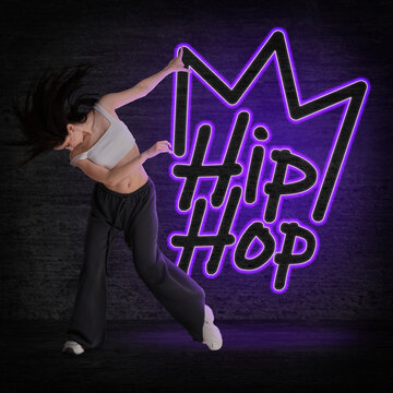 Young dancer posing against dark wall with neon sign Hip-hop. Creative poster
