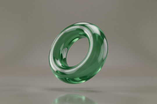 Abstract green glass torus shape with impossible reflections