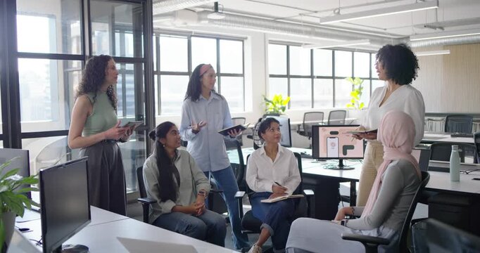 African American woman starting update with tablet at office, team taking notes, copy space