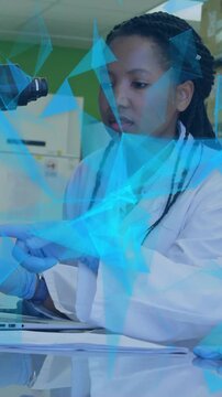 Animation of glowing light trails over diverse scientists in laboratory