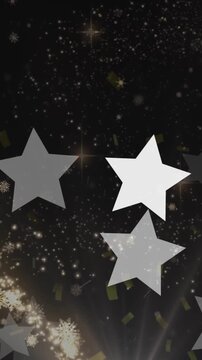 Animation of snowflakes and stars on black background