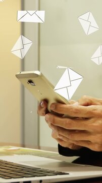 Animation of envelope icons over woman using smartphone and laptop