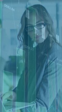 Animation of financial data processing over caucasian businesswoman in office
