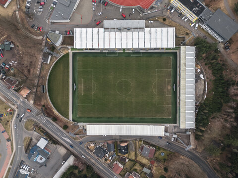 Jablonec nad Nisou, Czech Republic - March 23, 2025: Top-down aerial view of Stadion Strelnice, home of FK Jablonec, showing the football field and stands.