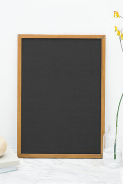 Blank chalkboard with wooden frame, suitable as mockup