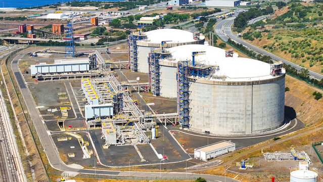 Aerial view of large oil storage tanks at an industrial petroleum terminal in Sines, Setubal, Portugal.