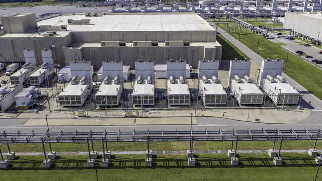 Aerial view of a row of industrial emergency backup diesel generator sets at a large data center facility in Clarksville, Tennessee, United States.