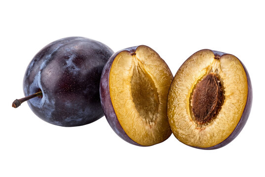 Whole purple plum next to a halved plum