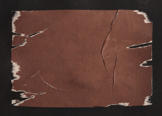 Plakat Brown Crumble ragged wrinkled paper pieces patch collage. Art Poster wall. Abstract grunge dirty texture black background.