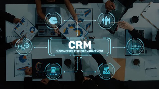 A top-down view of a business team engaged in a customer relationship management session, utilizing data charts and digital interface elements to guide their strategy. Raster