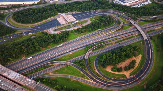 Approaching the New Jersey Turnpike crossing the green nature landscape. Middlesex County, New Jersey from drone.