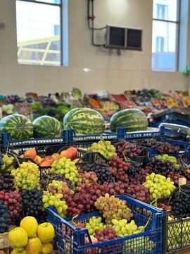 Fresh Colorful Grapes and Watermelons at Local Farmers Market
