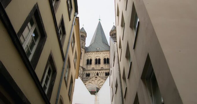 Historic Basilica architecture in central Cologne Germany featuring St Martin surrounded by scenic tourist streets and beautiful urban landscapes of Europe