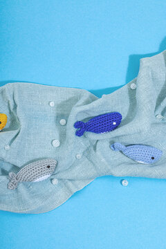 Summer crocheting concept. Handmade fishes, marine style. Underwater animals, different sharks