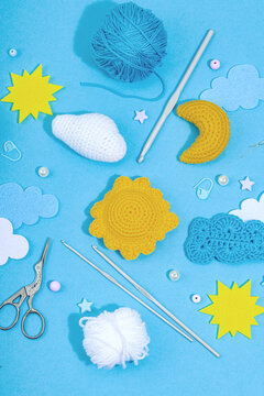 Set of clew of thread for knitting. Crocheted different weather symbols, handmade, creative concept