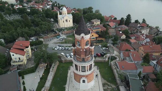 Pullback drone flight revealing Gardos Tower and Danube river at dusk, Zemun, Belgrade.