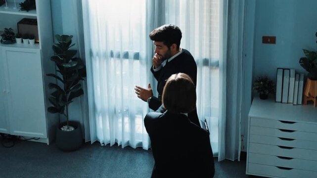 Top view of smart male leader calling phone while project manager give financial document. Businessman talking to investor to brainstorm idea by phone while looking at data analysis. Directorate.