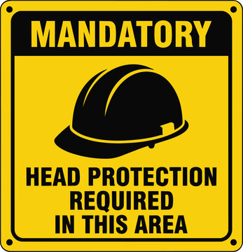A yellow and black mandatory safety sign requiring head protection, featuring a hard hat symbol and workplace safety instructions.