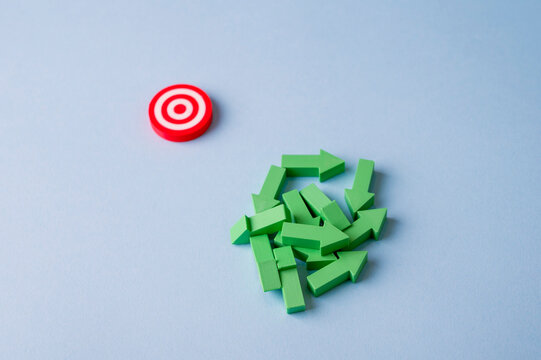 Lack of direction and confusion concept with scattered arrows away from target