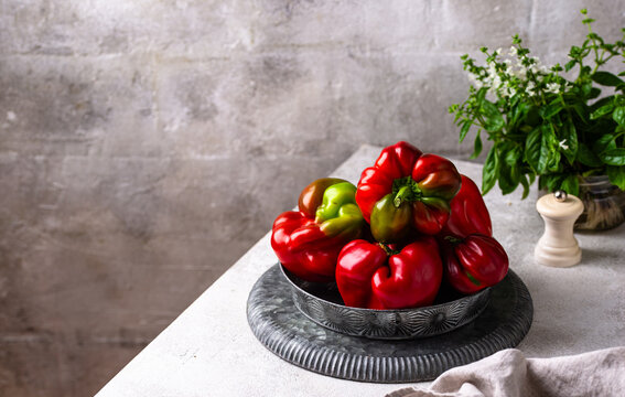 Fresh ripe sweet bell pepper on grey background