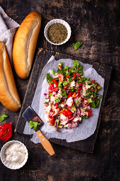 Trendy viral chopped Italian sandwich with tomato ham cheese and salad