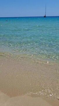 wonderful clear water and golden sand at solanas beach, sardinia, italy