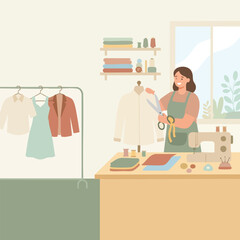 Fototapeta premium Flat vector illustration of a female fashion designer or tailor working in a cozy atelier sewing studio. A smiling woman wearing a green apron holding fabric scissors to adjust a white collared shirt
