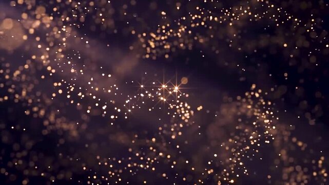 Golden sparkle dust floats gently through dark night sky like glowing magical particle shower