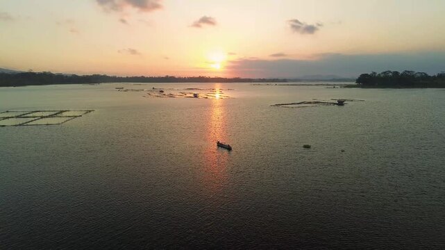 4K aerial drone footage of golden sunset over Sutami Dam lake in Malang East Java Indonesia