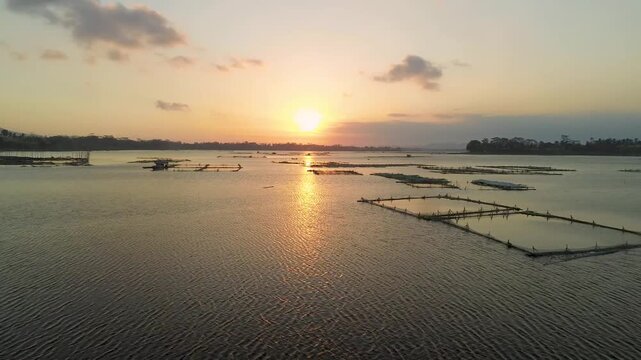 4K aerial drone footage of golden sunset over Sutami Dam lake in Malang East Java Indonesia