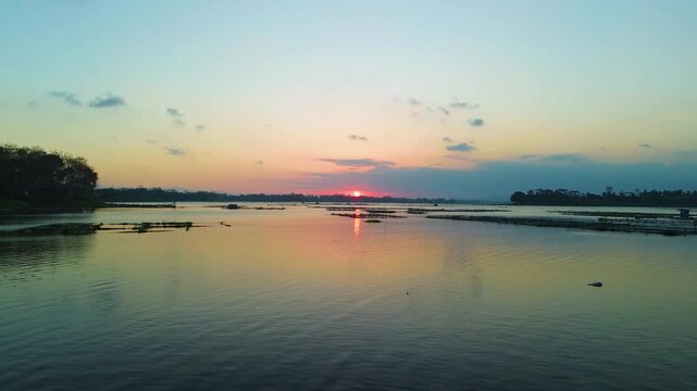 4K aerial drone footage of golden sunset over Sutami Dam lake in Malang East Java Indonesia