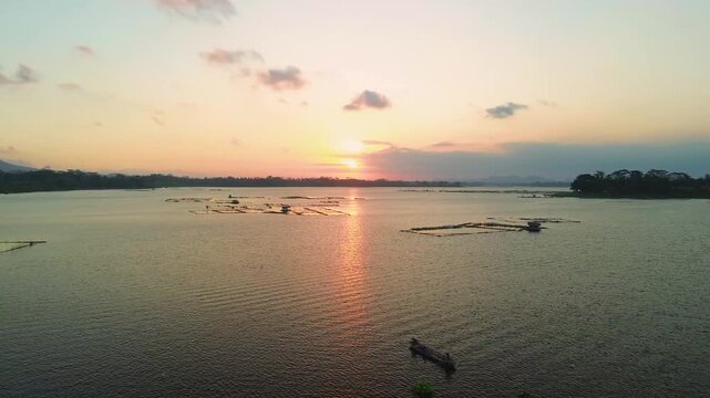 4K aerial drone footage of golden sunset over Sutami Dam lake in Malang East Java Indonesia