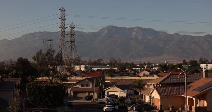 Afternoon sun shines on single family homes in the Declezville neighborhood of Fontana, California, USA.