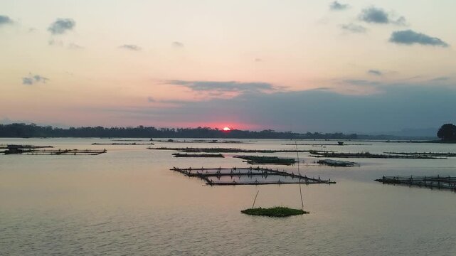 4K aerial drone footage of golden sunset over Sutami Dam lake in Malang East Java Indonesia