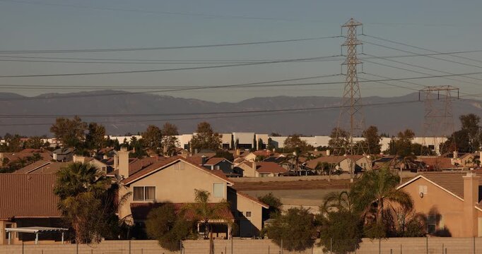 Afternoon sun shines on single family homes in the Declezville neighborhood of Fontana, California, USA.