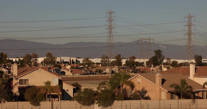 Afternoon sun shines on single family homes in the Declezville neighborhood of Fontana, California, USA.