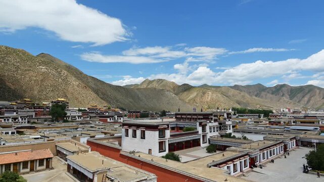 Panoramic Timelapse of Labrang Monastery in Gansu China with Mountain Backdrop