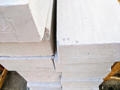 Stack of lightweight concrete blocks on pallet at construction site