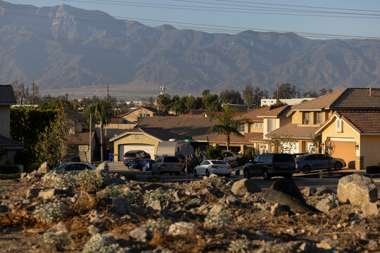 Afternoon sun shines on single family homes in the Declezville neighborhood of Fontana, California, USA.