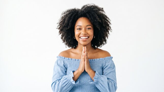 Beauty, emotions and education concept. Attractive african american cheerful woman with tattoos, hair floating in wind, press hands together, looking touched and grateful, smiling joyfully