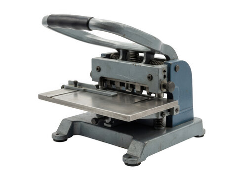 A vintage gray metal manual paper punch machine with a handle and steel base, isolated on a white background, for office and, printing equipment isolated on a transparent background
