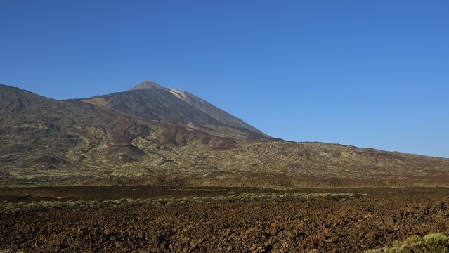 Barren volcanic landscape stretches under cloudless sky, Teide, Parque Nacional del Teide, Teide National Park, volcano, volcanism, UNESCO World Heritage Site, Tenerife, Canary Islands, Spain