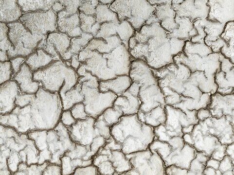 Abstract patterns of saline deposits at the salt works of Walvis Bay. Aerial view. Drone shot. Namibia
