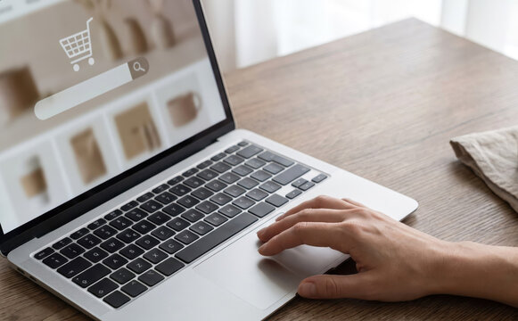 Online shopping on a modern laptop with e-commerce website displayed on screen for digital retail concepts