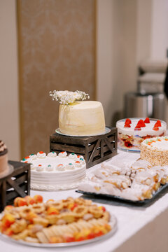 Celebration Dessert Table with Assorted Pastries and Cakes