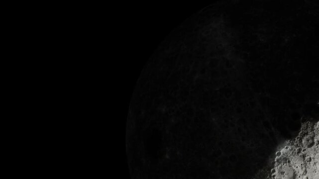 A view of the moon surface shows craters and textures against a dark background. The details highlight the rocky terrain and shadows on the lunar landscape.