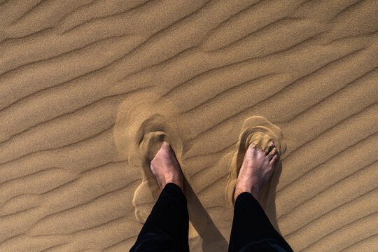 First-Person View of Adventurer Barefoot in Sand, Venezuela Tourism