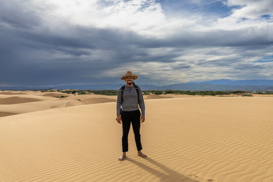 Young Latin Man Exploring the Desert Sand Dunes During Vacation in Falcon State, Venezuela
